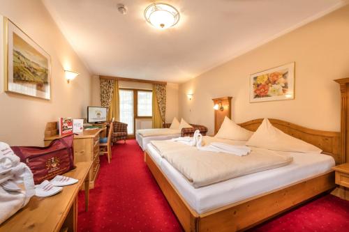 Posteľ alebo postele v izbe v ubytovaní Hotel Zauchenseehof