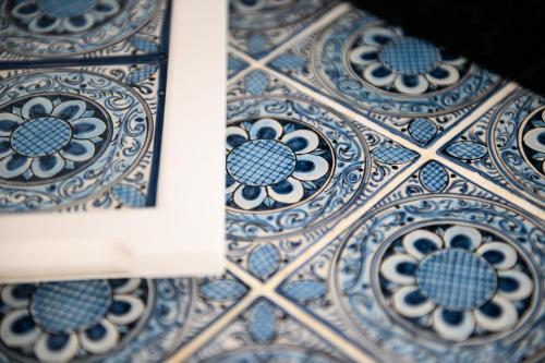 a close up of a blue and white tiled wall at Alma Suites in Naples