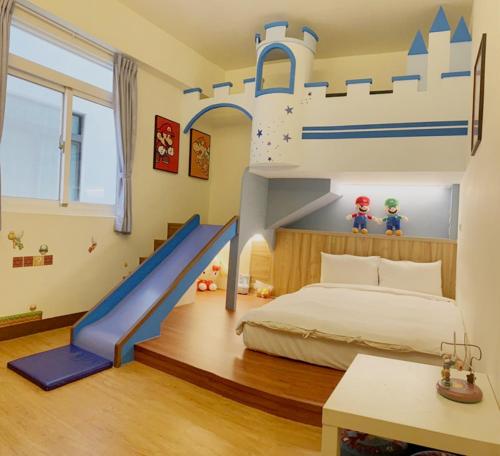 a bedroom with a bunk bed with a train theme at Mulin B&B in Hengchun
