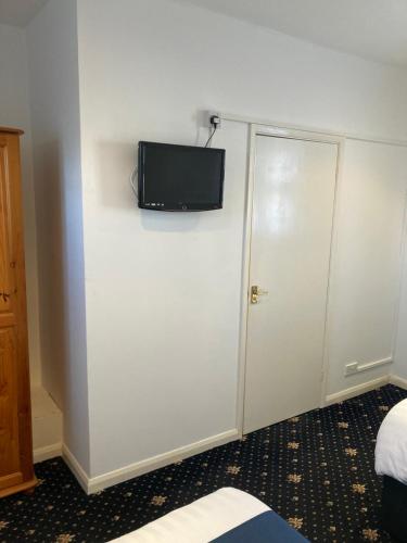 Televisyen dan/atau pusat hiburan di Abingdon Lodge Hotel