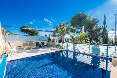 a swimming pool in a villa with a view at Ideal Property Mallorca - Villa Alcanada 1 in Alcanada