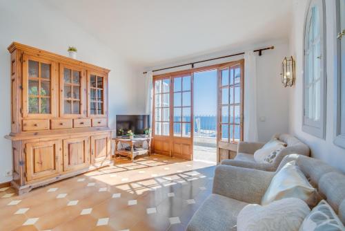 a living room with two couches and a television at Ideal Property Mallorca - Ram de Mar in Font de Sa Cala