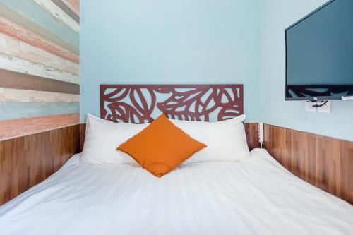 Cama o camas de una habitación en Tainan Weshare Hotel