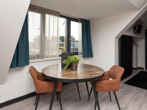 a dining room with a table and chairs at Studio in Domburg near Beach and Golf in Renesse