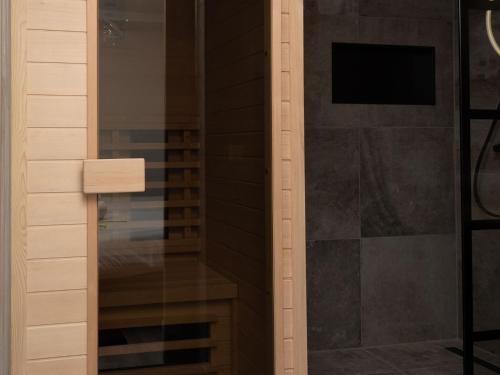 a shower with a glass door in a bathroom at Studio in Domburg near Beach and Golf in Renesse