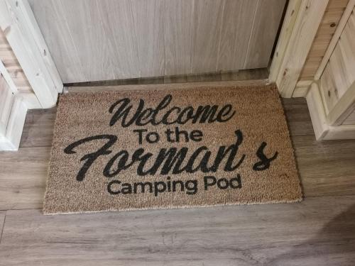 a welcome to the romans campingpod rug on a floor at Achmeney Glamping larger than Average pod in Halkirk