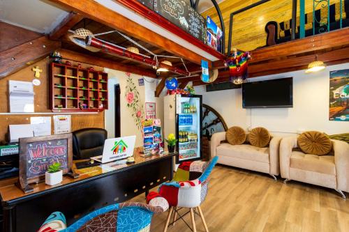 a living room filled with furniture and a flat screen tv at Friends Hotel & Rooftop in Quito