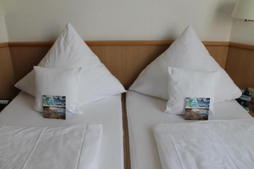 Nordsee Hotel Borkumにあるベッド