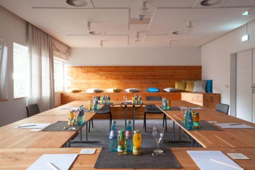 a large conference room with a long table with chairs at Waldhotel Eiche in Burg