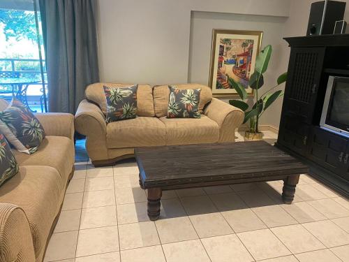 a living room with a couch and a coffee table at Tranquility in Margate