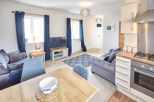 a living room with a couch and a table at Host & Stay - Coach House Retreat in Whitby