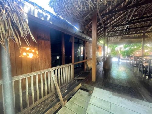 a person standing in front of a building at บ้านริมเลปากประ Banrimlay Pakpra in Phatthalung