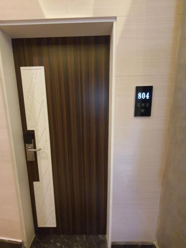 a door in a building with a clock on it at Fleet Club Mahrousa in Alexandria