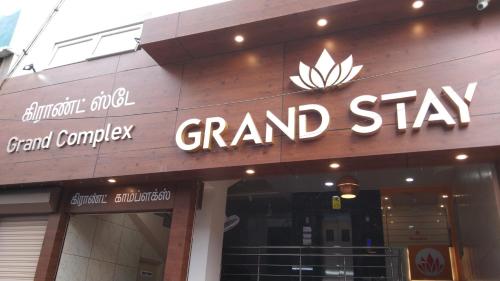 a grand sign on the front of a grand shop at Hotel Grand Stay in Tiruchchirāppalli