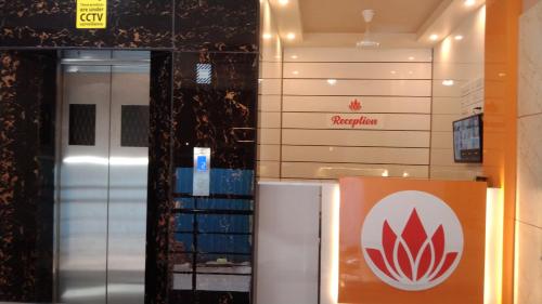 a sign for aarma company in a building at Hotel Grand Stay in Tiruchchirāppalli