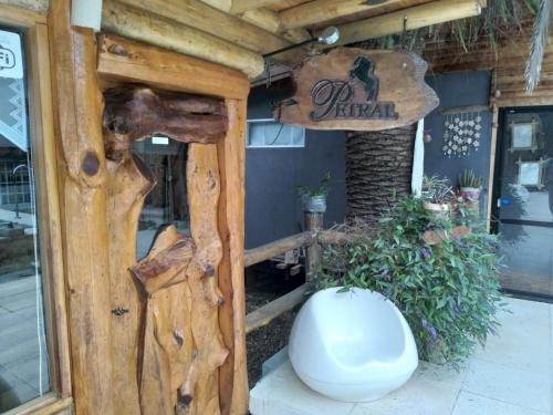 a toilet in front of a store with a sign at Pualy Resort & Spa in Belén de Escobar