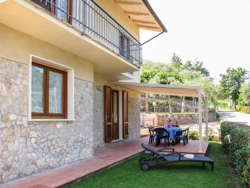 a patio of a house with a table and chairs at Holiday Home Cristina-2 by Interhome in Santa Lucia