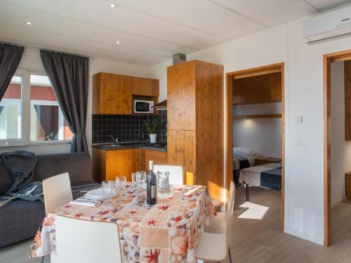 A kitchen or kitchenette at Holiday Home Mandorlo - SLR401 by Interhome