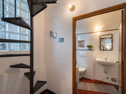 a bathroom with a toilet and a sink at Apartment Casa del Cavaliere by Interhome in Dolcedo