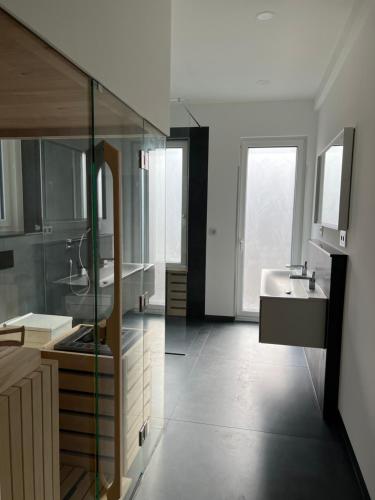 a large bathroom with a sink and a mirror at the season in Karlsruhe