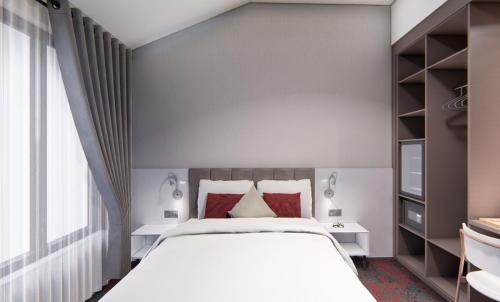 A bed or beds in a room at SPARK HOTEL RESIDENCE KONYA