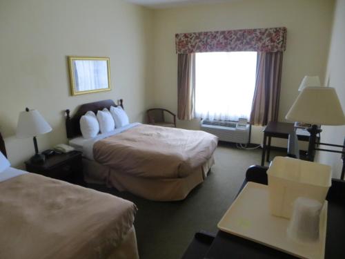 Ένα ή περισσότερα κρεβάτια σε δωμάτιο στο Quality Inn Winder, GA