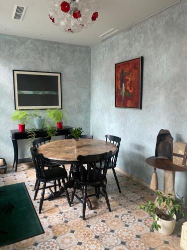 a dining room with a table and chairs at Villa Promenade in Burgas City