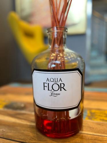 a bottle of sauce sitting on a wooden table at the season in Karlsruhe