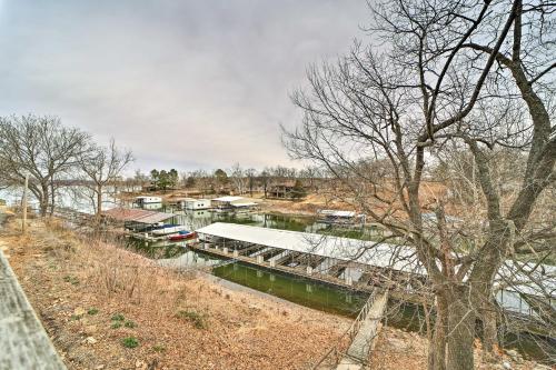 a river with a marina with boats in it at Lakefront Eucha Escape with Views and Boat Slip! in Eucha