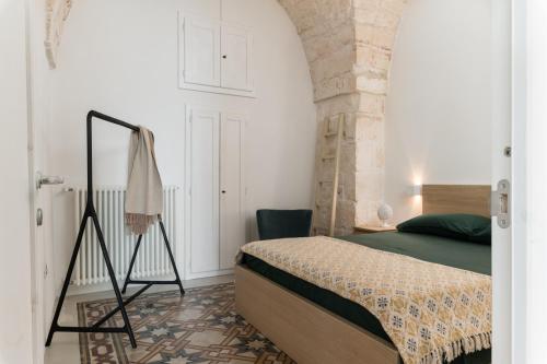 Un pat sau paturi într-o cameră la Casetta Annina by Wonderful Italy