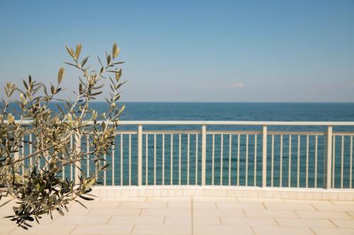 a balcony with the ocean in the background at Zefyros Sea View Hotel in Platamonas