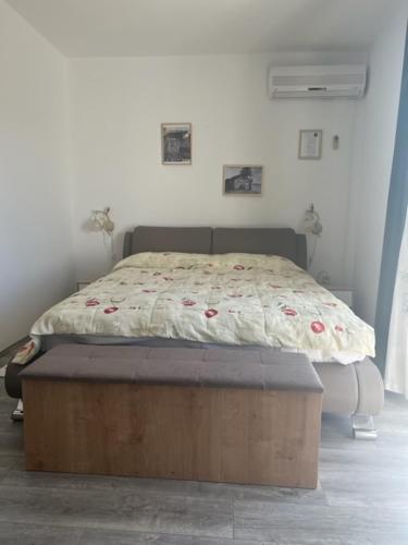 a bed in a white room with a bed sidx sidx sidx sidx at Villa Fontana in Starigrad-Paklenica