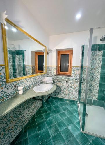 a bathroom with a sink and a shower at Casa Aprea in Sorrento
