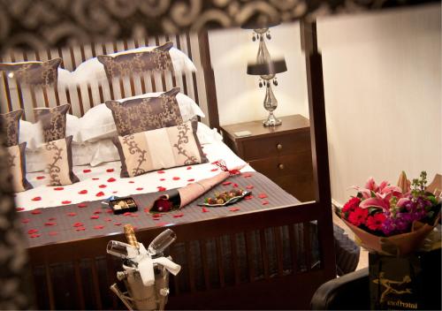 a bedroom with a bed with a doll on it at The Howbeck & The Retreat Central location, incl off-site Health Club and parking EV point available, GREAT DEALS ON in Windermere