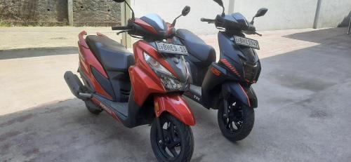 two motorcycles parked next to each other on a street at Mount View Bungalow in Hatton