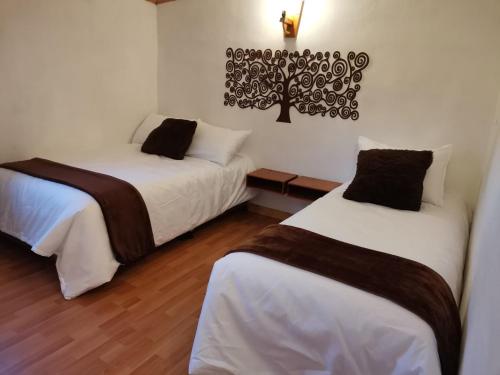 Кровать или кровати в номере Hotel Mi Villa