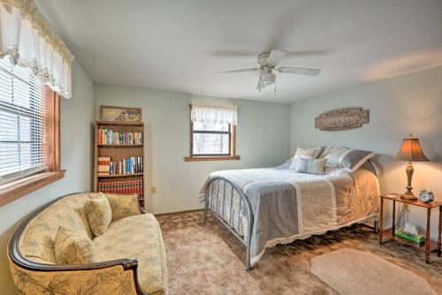 a bedroom with a bed and a ceiling fan at The Lakehouse Lovely Wappapello Country Home! in Wappapello