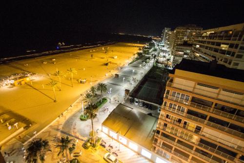 an aerial view of a city at night at PRIMERISIMA LINEA DE PLAYA - CULLERA BAHIA DE LOS NARANJOS I in Cullera