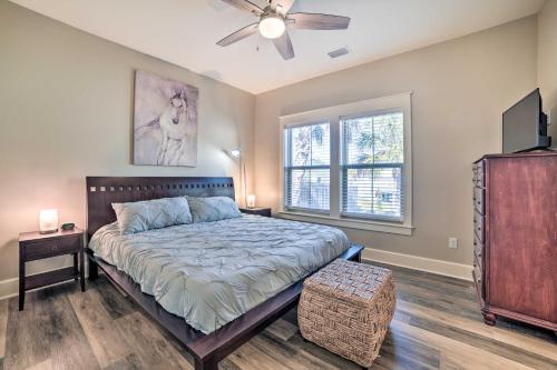 a bedroom with a bed and a ceiling fan at Mexico Beach Getaway with Patio - Steps to Beach! in Mexico Beach