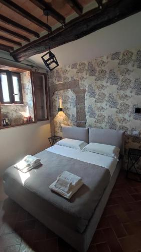 Ένα ή περισσότερα κρεβάτια σε δωμάτιο στο Etrusco Home & Relax