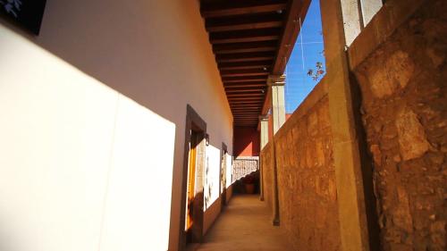 an alleyway between two buildings with awnings on a building at Hotel Boutique Casa Madero in Morelia