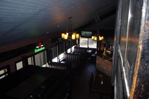 an overhead view of a bar with chairs and lights at South Hill Lodge in Prince Albert