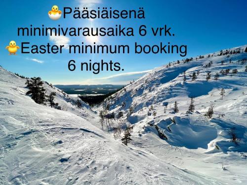 a mountain covered in snow with the words pakistan minivanivanomnia at Lapland Tunturimaja Ski in, sauna, wifi, in Pyhä center - Lapland Villas in Pyhätunturi