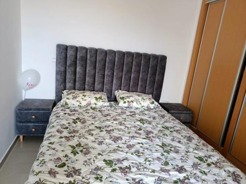 Ένα ή περισσότερα κρεβάτια σε δωμάτιο στο Marina Golf Asilah Vue mer et golf