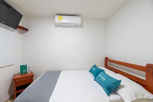 Кровать или кровати в номере Hotel Nuevo Yalu