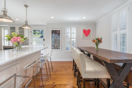 a kitchen with a wooden table and chairs at 45A Pleasant St in Nantucket