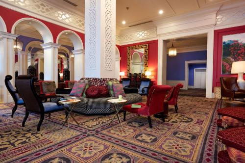 a lobby with chairs and a couch and a table at The Royal Sonesta Portland Downtown in Portland