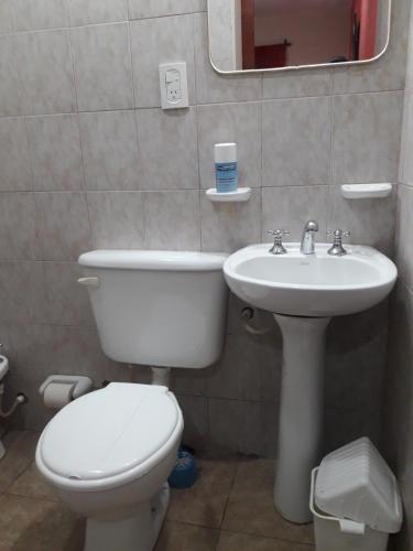 a bathroom with a toilet and a sink at Habitaciones BRISA in Salta