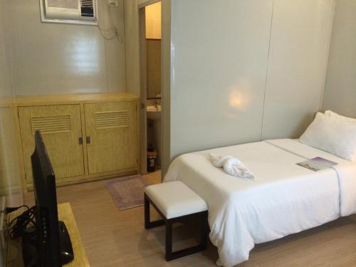 Una cama o camas en una habitación de Shore Time Hotel - Annex