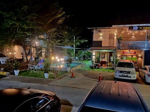 a car parked in front of a house at night at Tc theme park Guest house in Kuantan
